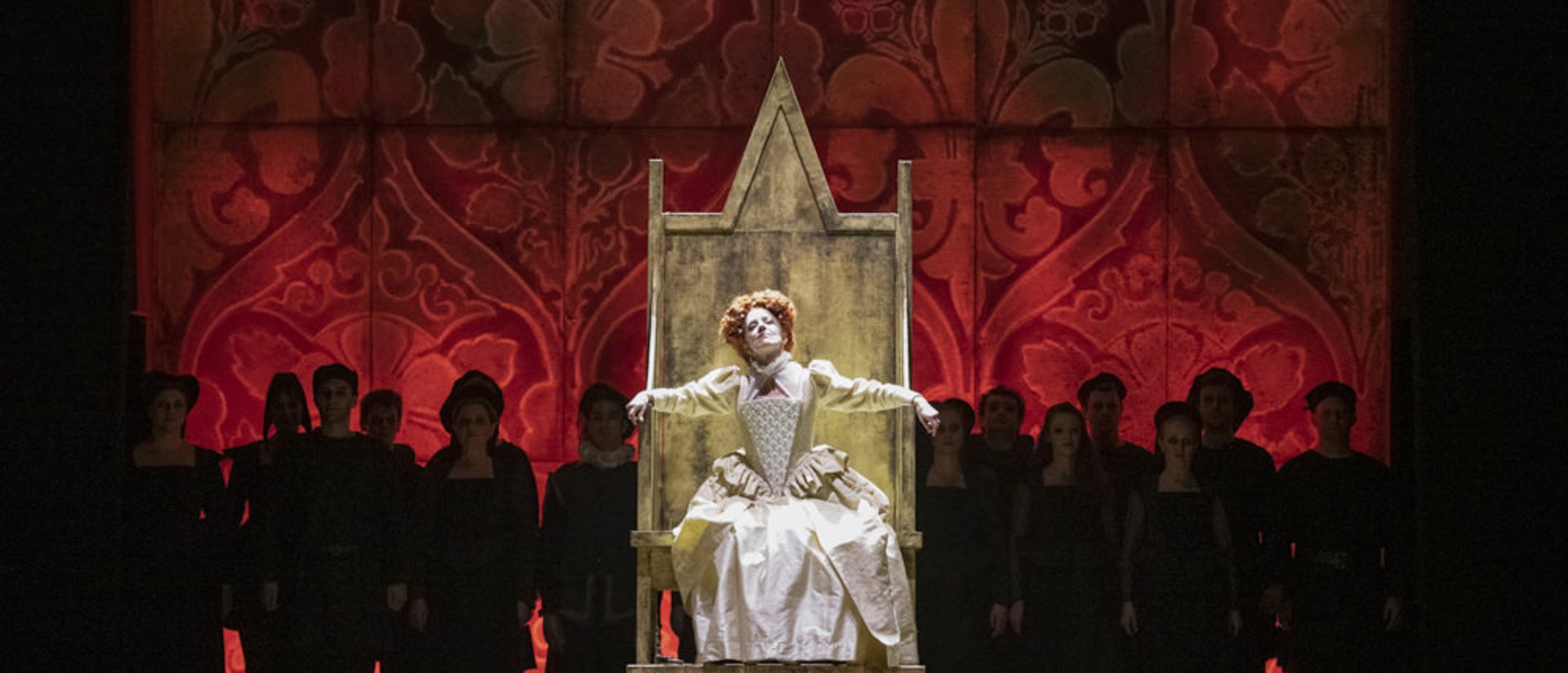 Elizabeth I sitting on throne surrounded by chorus