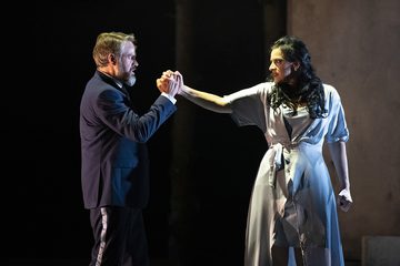 Macbeth and Lady Macbeth gripping hands