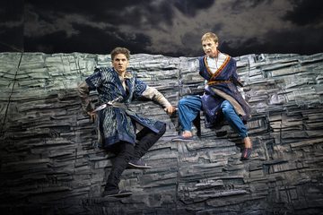 Two opera singers on a rocky, grey lancscape in ETO's 2018 Radamisto
