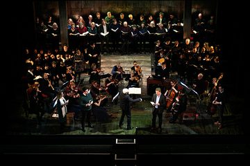 Conductor with orchestra, soloists and choirs